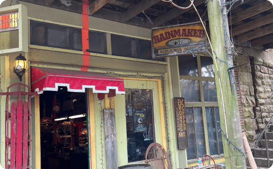 A store front with a sign that says rainmaker 's.