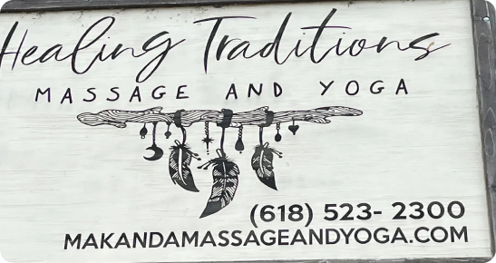 A sign for a massage and yoga studio.